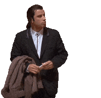 a man in a suit and tie is holding a jacket