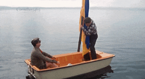 two men in a small boat in the water with the name cornelius5465 on the bottom