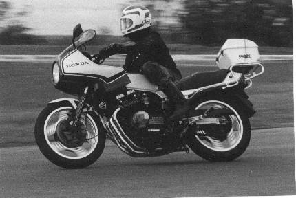 Phil Hall on his CBX doing travelling marshall duties, Oran Park 1984