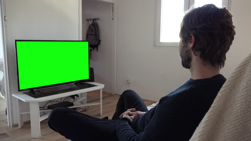 Man Watching Tv Sitting On Stock-video (100 % royaltyfri) 1024077428 |  Shutterstock