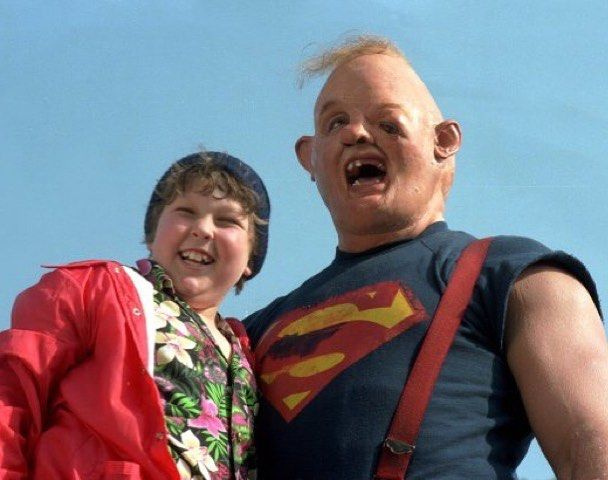 In (The goonies 1985) The reason why sloth has this deformity is because  Mama Fratelli dropped him when he was a baby (Remember? I sang to you.  "When you were a little