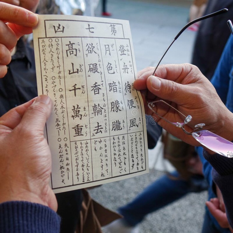omikuji-you-hands-hold-written-fortune-tells-good-bad-sensoji-temple-area-asakusa-section-tokyo-japan-april-194225928.jpg